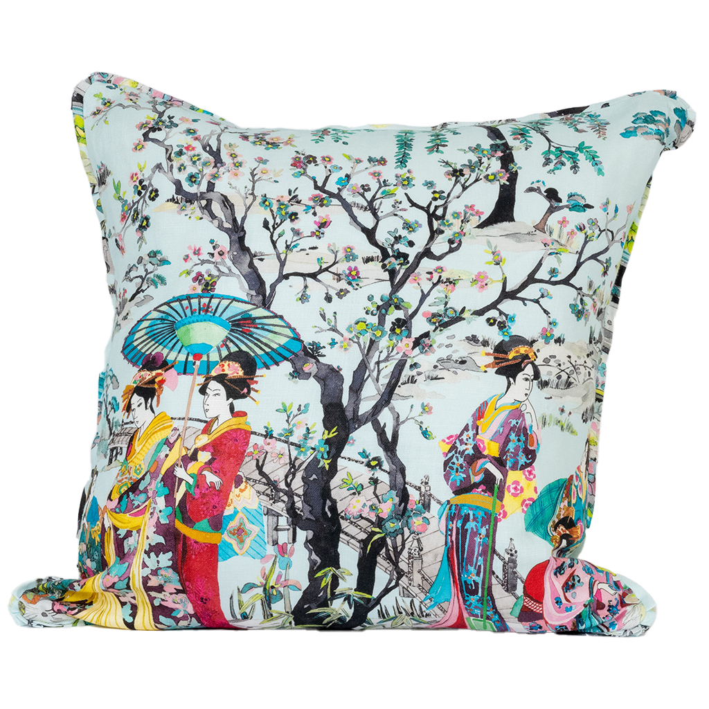 Turquoise background with tree with cherry blossoms and 3 asian women in kimonos with an umbrella. front of pillow