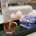 image of pink acrylic heart vase on a tray 