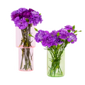 pink and green portion of vase separated into two. With purple flowers