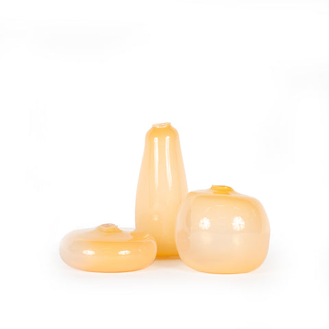 Melon Medium Rounded Vase alongside collection of melon vases in various sizes